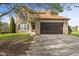 Charming two-story home featuring a brick facade, attached garage, and well-maintained front yard at 6514 Trevia Ct, Indianapolis, IN 46236