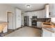 Spacious kitchen with white cabinets, stainless steel appliances, and stylish backsplash adds a modern appeal at 6514 Trevia Ct, Indianapolis, IN 46236