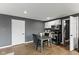 Charming kitchen with white cabinets, modern appliances, and a cozy dining area with a table and chairs at 6514 Trevia Ct, Indianapolis, IN 46236