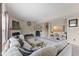 Bright living room features a cozy fireplace, plush sectional, and modern decor, offering a comfortable space at 6514 Trevia Ct, Indianapolis, IN 46236