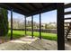 Covered patio overlooking a serene pond with lush green surroundings at 6514 Trevia Ct, Indianapolis, IN 46236