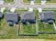 Aerial view of home with a fenced backyard, green lawn, and proximity to neighborhood streets at 7144 Hart St, Cumberland, IN 46229