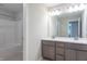 Bathroom featuring a double vanity with modern faucets and walk-in shower at 7144 Hart St, Cumberland, IN 46229