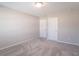 This bedroom features neutral paint, carpet, and two doors for easy access at 7144 Hart St, Cumberland, IN 46229