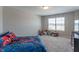 bedroom with a spider-Personal themed bed, toys and carpet floors at 7144 Hart St, Cumberland, IN 46229