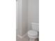 Bathroom featuring a white toilet, corner, and light gray flooring at 7144 Hart St, Cumberland, IN 46229