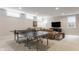 Finished basement with ping pong table, sofa, TV, and plenty of space to relax at 7602 N Pennsylvania St, Indianapolis, IN 46240