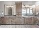 Large bathroom vanity with double sinks, lots of storage, and modern lighting at 7602 N Pennsylvania St, Indianapolis, IN 46240
