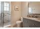 Elegant bathroom featuring a glass shower with marble tile and brushed nickel fixtures at 7602 N Pennsylvania St, Indianapolis, IN 46240
