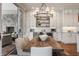 Bright kitchen with an island, dining table, modern appliances, and seamless transition to a screened-in patio at 7602 N Pennsylvania St, Indianapolis, IN 46240