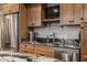 Close up of the kitchen with stainless steel appliances and stone countertops at 7602 N Pennsylvania St, Indianapolis, IN 46240