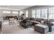 Living room with a large sectional, accent chairs, and adjacent playroom at 7602 N Pennsylvania St, Indianapolis, IN 46240