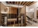 Home sauna with glass enclosure and wooden benches at 7602 N Pennsylvania St, Indianapolis, IN 46240