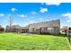Expansive backyard with well-kept lawn, hot tub, and brick home at 7618 Ballyshannon St, Indianapolis, IN 46217