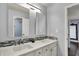 Bathroom with double sink vanity and modern lighting at 7618 Ballyshannon St, Indianapolis, IN 46217