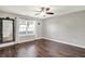 Empty bedroom with light gray walls and natural light from the surrounding window at 7618 Ballyshannon St, Indianapolis, IN 46217