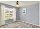 This bedroom features a ceiling fan, window with blinds, and carpet at 7618 Ballyshannon St, Indianapolis, IN 46217