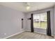 Bedroom with window, mounted TV bracket, and carpeted floors at 7618 Ballyshannon St, Indianapolis, IN 46217