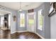 Foyer featuring an exterior door and natural light from surrounding windows, plus views of the living room at 7618 Ballyshannon St, Indianapolis, IN 46217