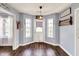 Foyer featuring an exterior door, natural light from surrounding windows, and decorative accents at 7618 Ballyshannon St, Indianapolis, IN 46217