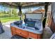 A close-up view of a relaxing hot tub inside a covered gazebo at 7618 Ballyshannon St, Indianapolis, IN 46217