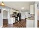 Bright kitchen with stainless steel appliances, white cabinetry, and sleek countertops at 7618 Ballyshannon St, Indianapolis, IN 46217