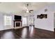 Bright living room featuring a fireplace and natural light from surrounding windows at 7618 Ballyshannon St, Indianapolis, IN 46217