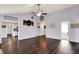 Bright living room with vaulted ceiling and natural light from surrounding windows at 7618 Ballyshannon St, Indianapolis, IN 46217