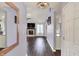 View from the entry to the living room showcasing a fireplace and lots of natural light at 7618 Ballyshannon St, Indianapolis, IN 46217