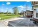 Back patio with hot tub and expansive yard, perfect for entertaining at 7618 Ballyshannon St, Indianapolis, IN 46217