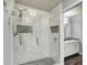Elegant glass shower with subway tile and built-in shelves at 7618 Ballyshannon St, Indianapolis, IN 46217