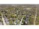 Extensive aerial perspective of a vibrant neighborhood nestled among lush greenery with a mix of houses and streets at 775 W Hawthorne St, Zionsville, IN 46077