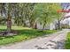 Charming home with well-manicured front yard, mature landscaping, and a gravel driveway at 775 W Hawthorne St, Zionsville, IN 46077