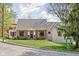 Charming brick home with a balcony and well-maintained lawn on a sunny day at 775 W Hawthorne St, Zionsville, IN 46077