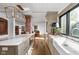 Elegant kitchen featuring marble countertops, custom cabinets, and stainless steel appliances with a large sink at 775 W Hawthorne St, Zionsville, IN 46077