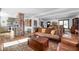 Open-concept living space featuring hardwood floors, elegant furnishings, and lots of light throughout the room at 775 W Hawthorne St, Zionsville, IN 46077