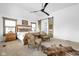 Spacious primary bedroom featuring a bed with many pillows, sitting area and ensuite with natural light at 775 W Hawthorne St, Zionsville, IN 46077