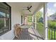 Charming porch with classic railings and aged wood flooring offers a tranquil outdoor spot with neighborhood views at 775 W Hawthorne St, Zionsville, IN 46077