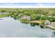 Scenic lakefront residences with sandy beach, lush landscapes, and inviting pool area, designed for an exceptional lifestyle at 7786 Harbour Isle, Indianapolis, IN 46240