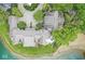 Aerial view of the property featuring a lush lawn, access to a sandy beach, and lake access at 7786 Harbour Isle, Indianapolis, IN 46240