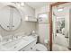 Bathroom featuring a modern vanity, round mirror, and decorative touches for a clean and stylish look at 7786 Harbour Isle, Indianapolis, IN 46240