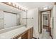 Well-lit bathroom with a spacious vanity, ample storage, and a convenient doorway leading to the shower at 7786 Harbour Isle, Indianapolis, IN 46240