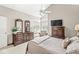 Bright bedroom featuring high ceilings, windows, a dresser, and closet space for comfortable and stylish living at 7786 Harbour Isle, Indianapolis, IN 46240
