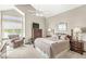 Cozy bedroom featuring neutral tones, ceiling fan, and dresser with TV for relaxed living at 7786 Harbour Isle, Indianapolis, IN 46240