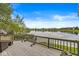 Spacious deck with scenic lake views offers a perfect spot for outdoor relaxation and entertaining at 7786 Harbour Isle, Indianapolis, IN 46240