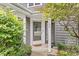 Charming front entrance features well-maintained landscaping and a welcoming pathway to the front door at 7786 Harbour Isle, Indianapolis, IN 46240