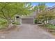 Attached garage and well-maintained exterior with landscaped front yard offer convenience and curb appeal at 7786 Harbour Isle, Indianapolis, IN 46240