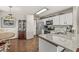 Well-equipped kitchen with granite countertops, stainless steel appliances, and adjacent breakfast nook and dining room at 7786 Harbour Isle, Indianapolis, IN 46240