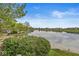 Breathtaking lake view showcasing tranquil waters and well-maintained landscaping, offering a serene environment at 7786 Harbour Isle, Indianapolis, IN 46240