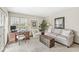 Comfortable and stylish living room featuring a work space and large windows with a view at 7786 Harbour Isle, Indianapolis, IN 46240